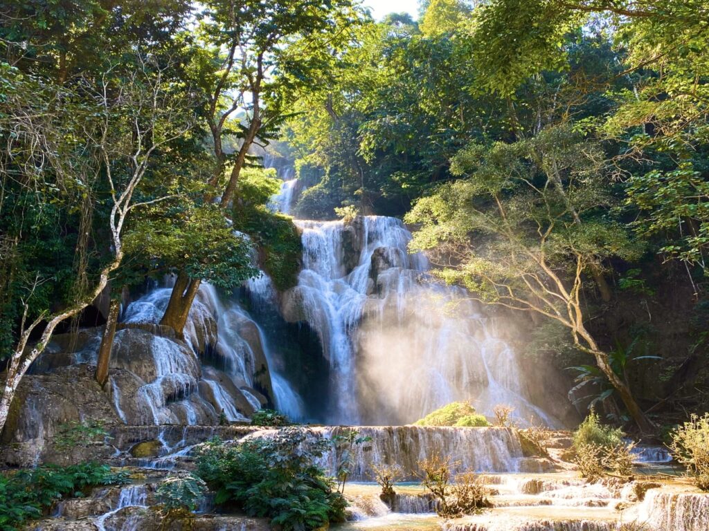 KuangSi waterfall in Luangprabang. Crystal blue waters flowing over limestone rocks