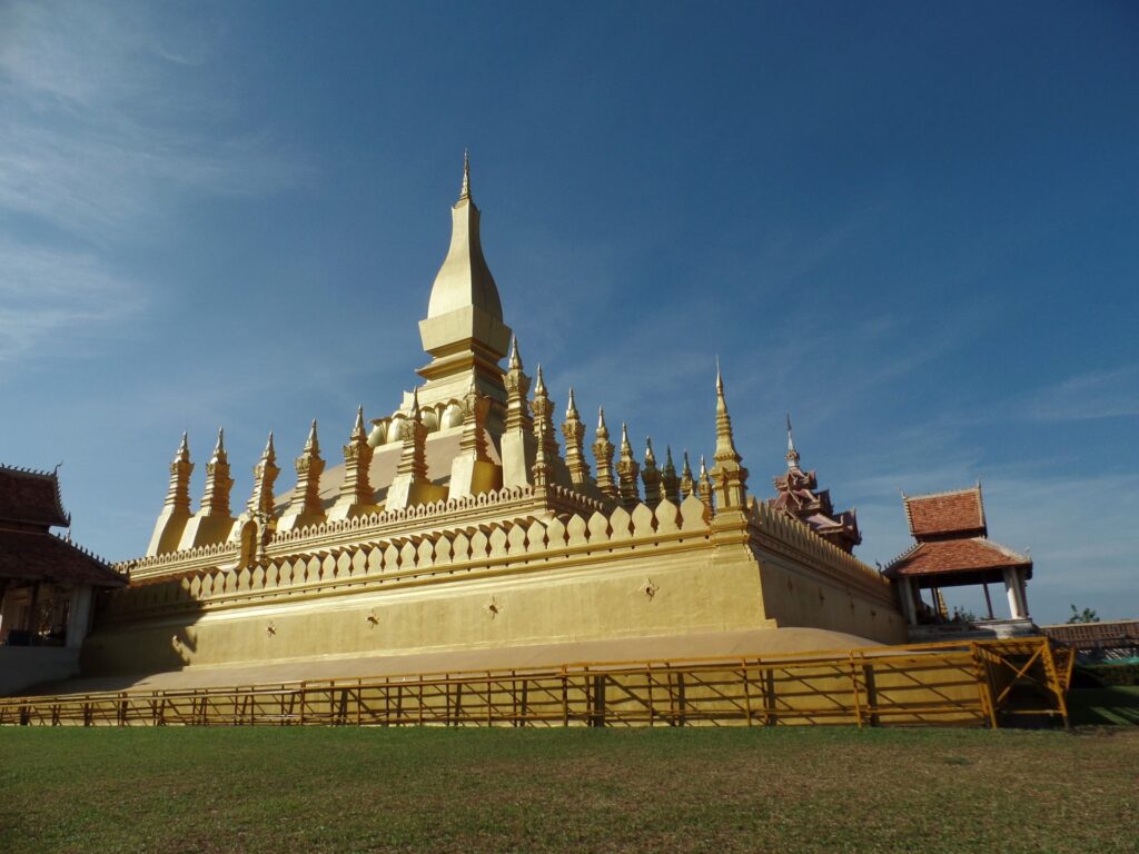 Pha That Luang ("Great Stupa") a Golden temple with a blue sky backdrop.