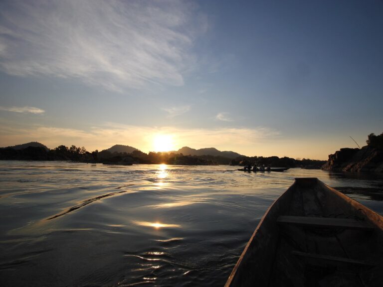 view of small islands in the sunset from a canoe