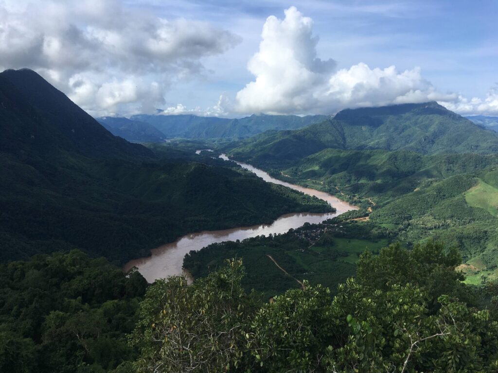 View from a mountain top hike showing a river and green landscape