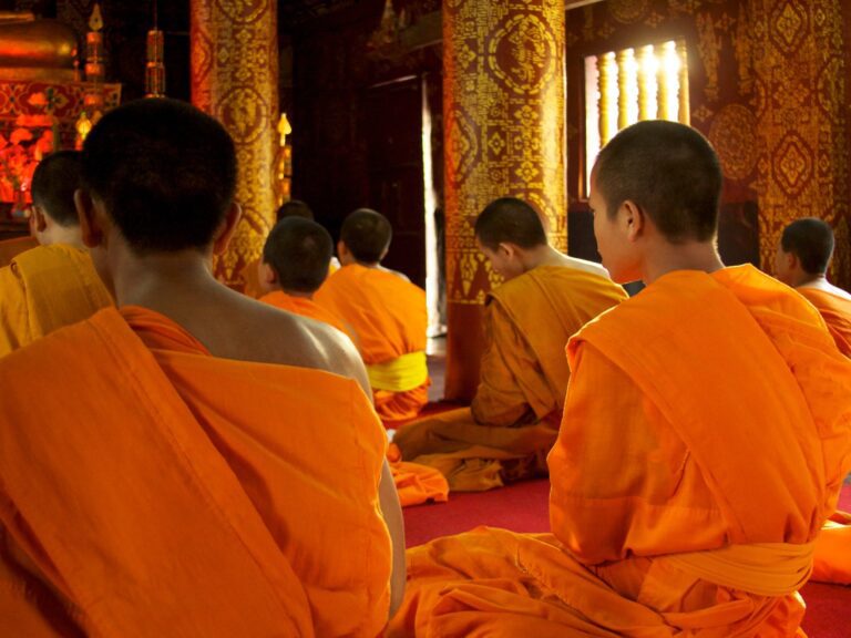 monks sitting in a temple